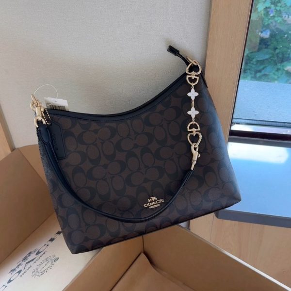 Coach dark brown with black trim shoulder bag