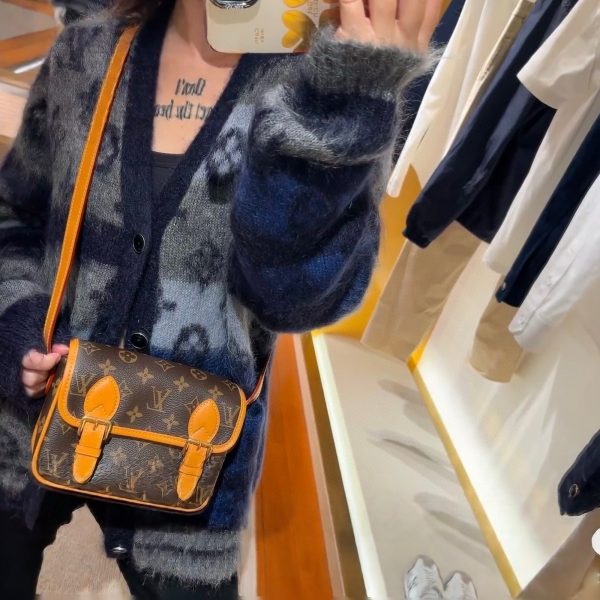 Louis Vuitton brown with tan trim satchel
