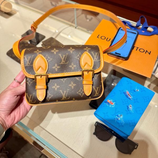 Louis Vuitton brown with tan trim satchel