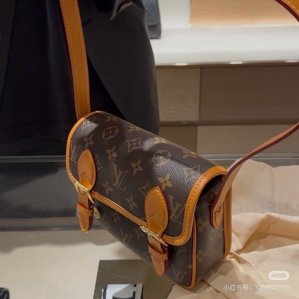 Louis Vuitton brown with tan trim satchel