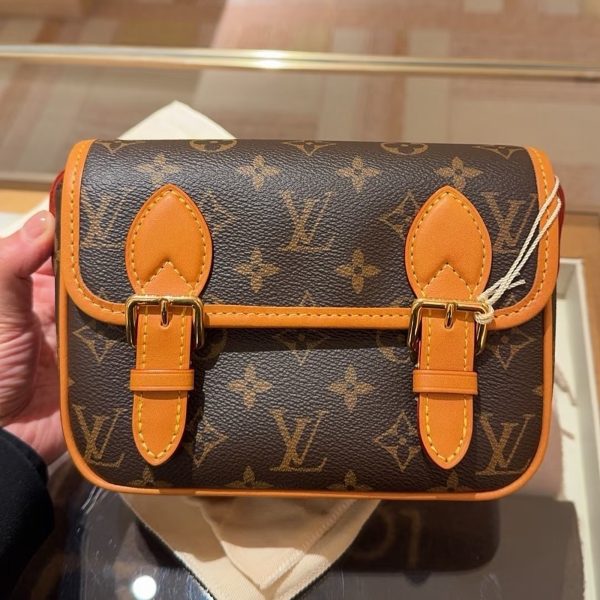 Louis Vuitton brown with tan trim satchel