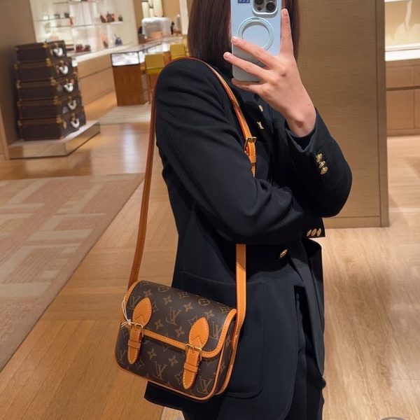 Louis Vuitton brown with tan trim satchel