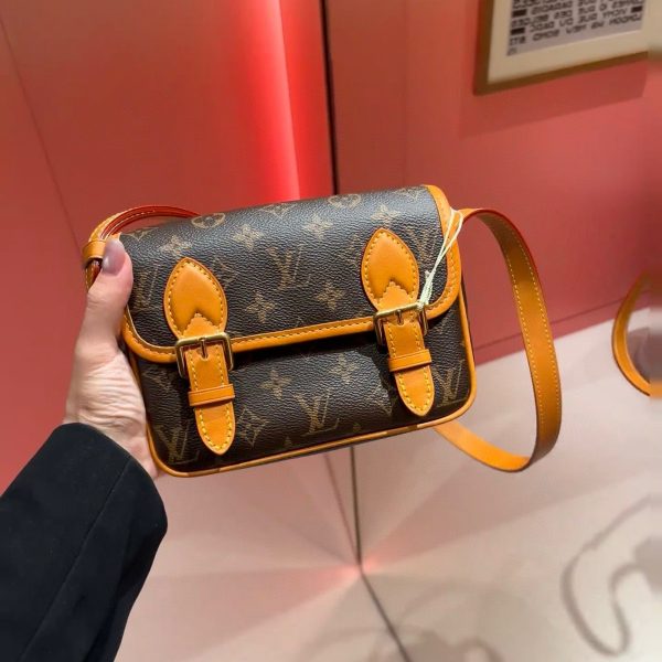 Louis Vuitton brown with tan trim satchel